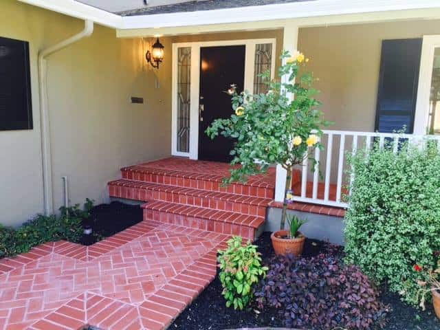 Pink path leading to house door